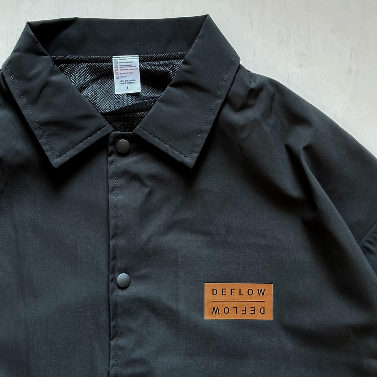 DEFLOW COACH JACKET BLACK